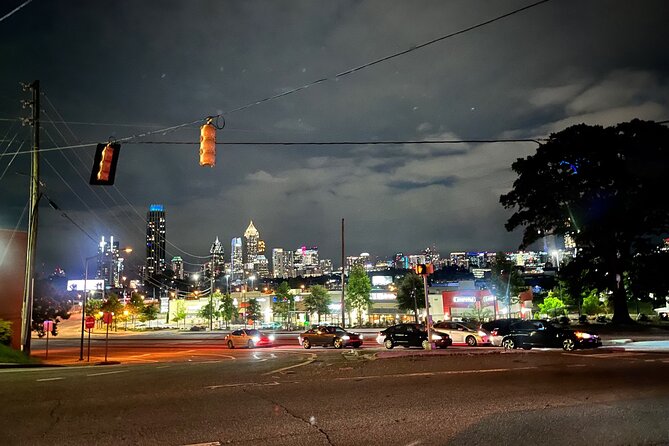 City Lights Atlanta Night-Time Tour with Photos & Dinner Stop - The first ride: downtown lights, a movie palace, and Ponce de Leon Avenue