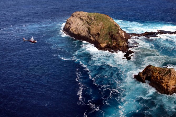 Deluxe Helicopter Tour of Molokai and Maui - Honokohau Falls and the Haleakala horizon before landing