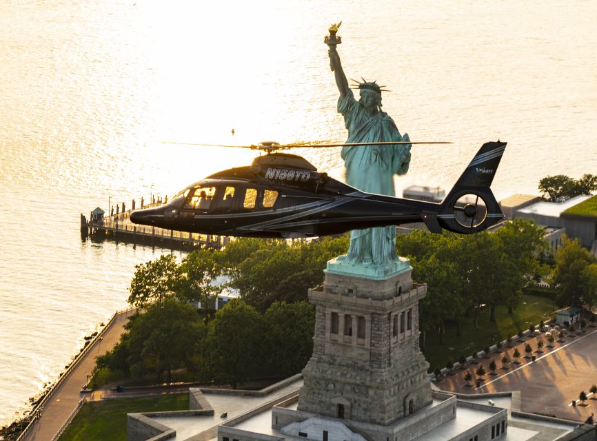 From New Jersey: New York City Skyline Tour - Night flight route: Statue of Liberty glow, Times Square, and headlight streets