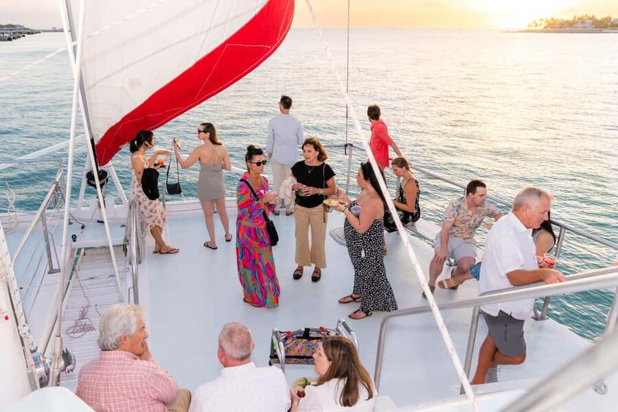 Key West Signature Sunset Cruise with Open Bar, Food & Music - Sailing Toward the Horizon: Views, Boats in the Foreground, and Photos