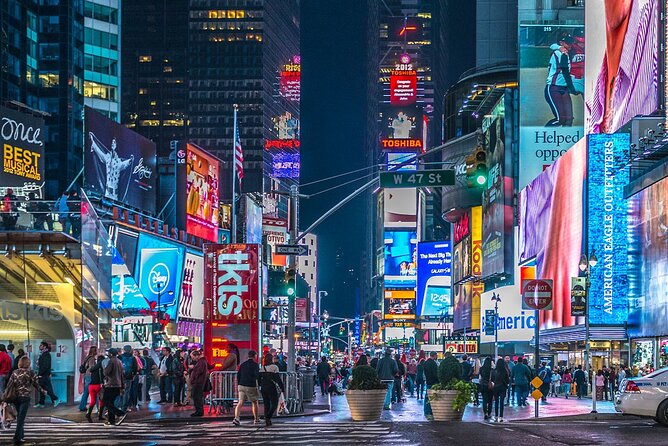 New York Night Tour: Open Top Bus Tour by TopView® - Chinatown and Little Italy: night lights, signage, and close-up energy
