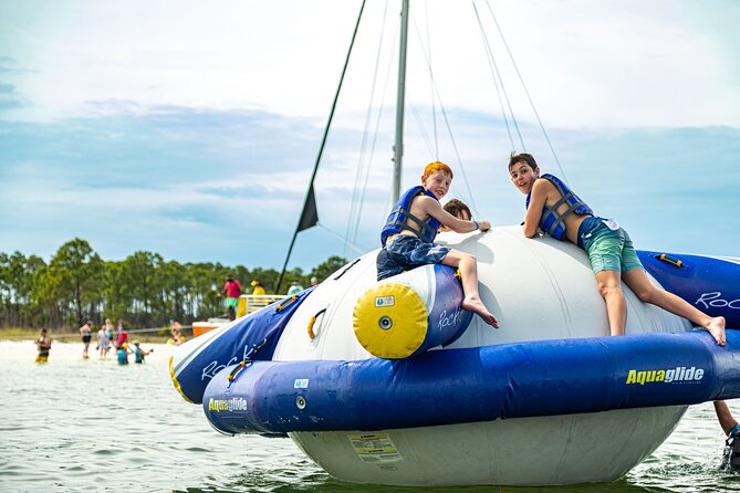Shell Island Inflatable Adventure Park & Dolphin Sightseeing Tour - Crew, Music, and the Privateer Atmosphere